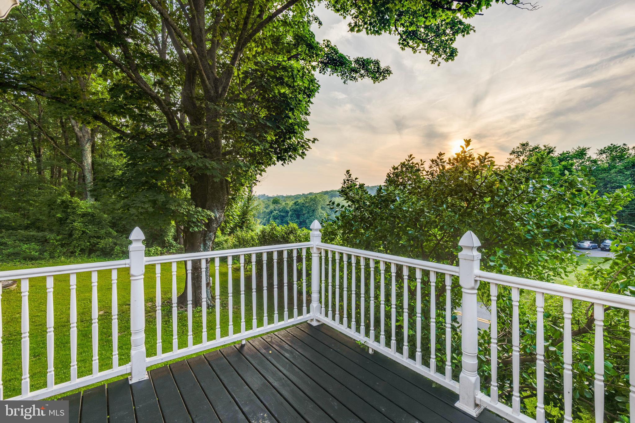 1801 Stringtown Road Sparks Glencoe, MD 21152 - Photo 8 of 26 a balcony with wooden floor and fence