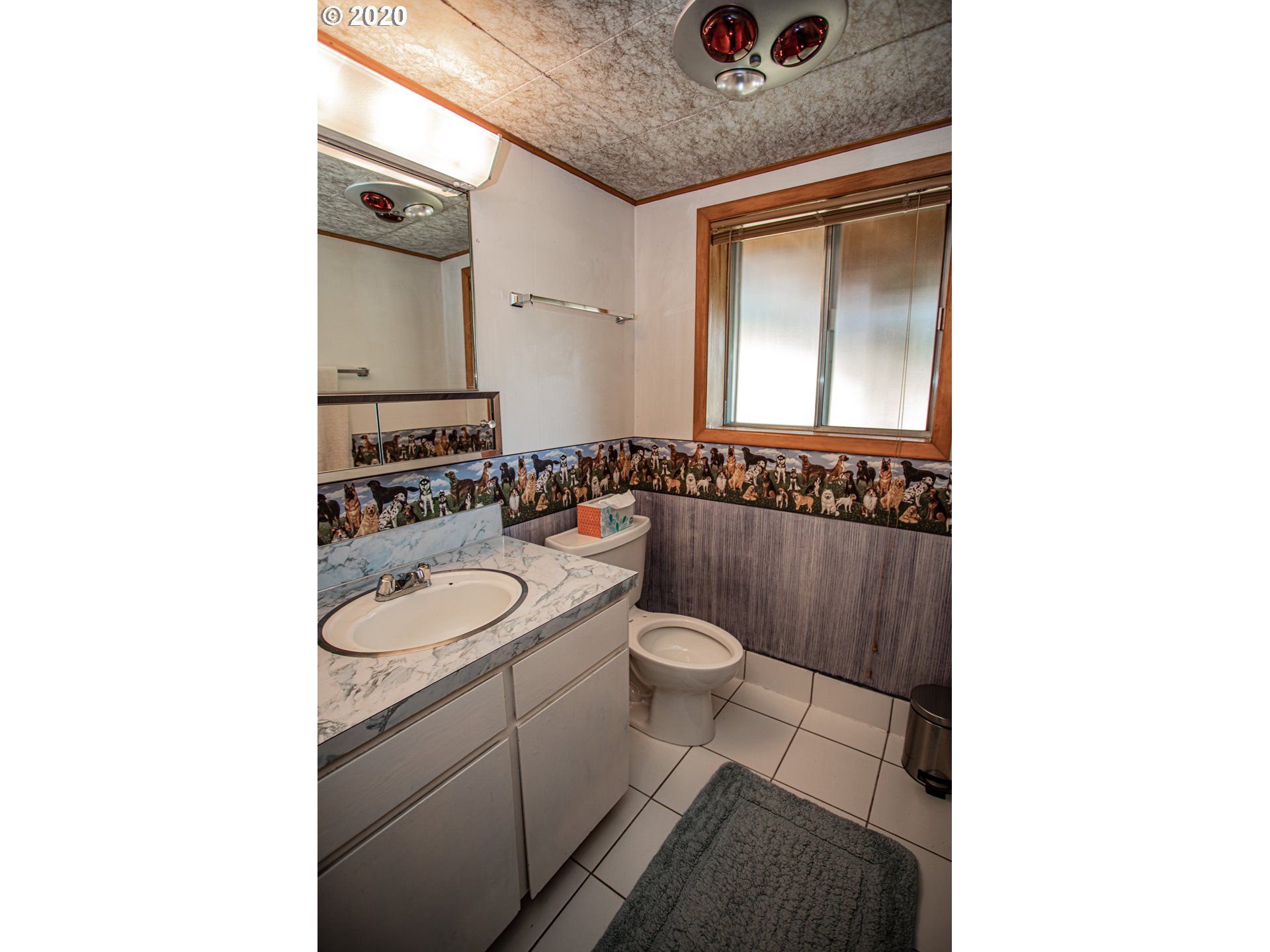 250 Ridgecrest Drive Stevenson, WA 98648 - Photo 21 of 32 a bathroom with a toilet a sink and mirror