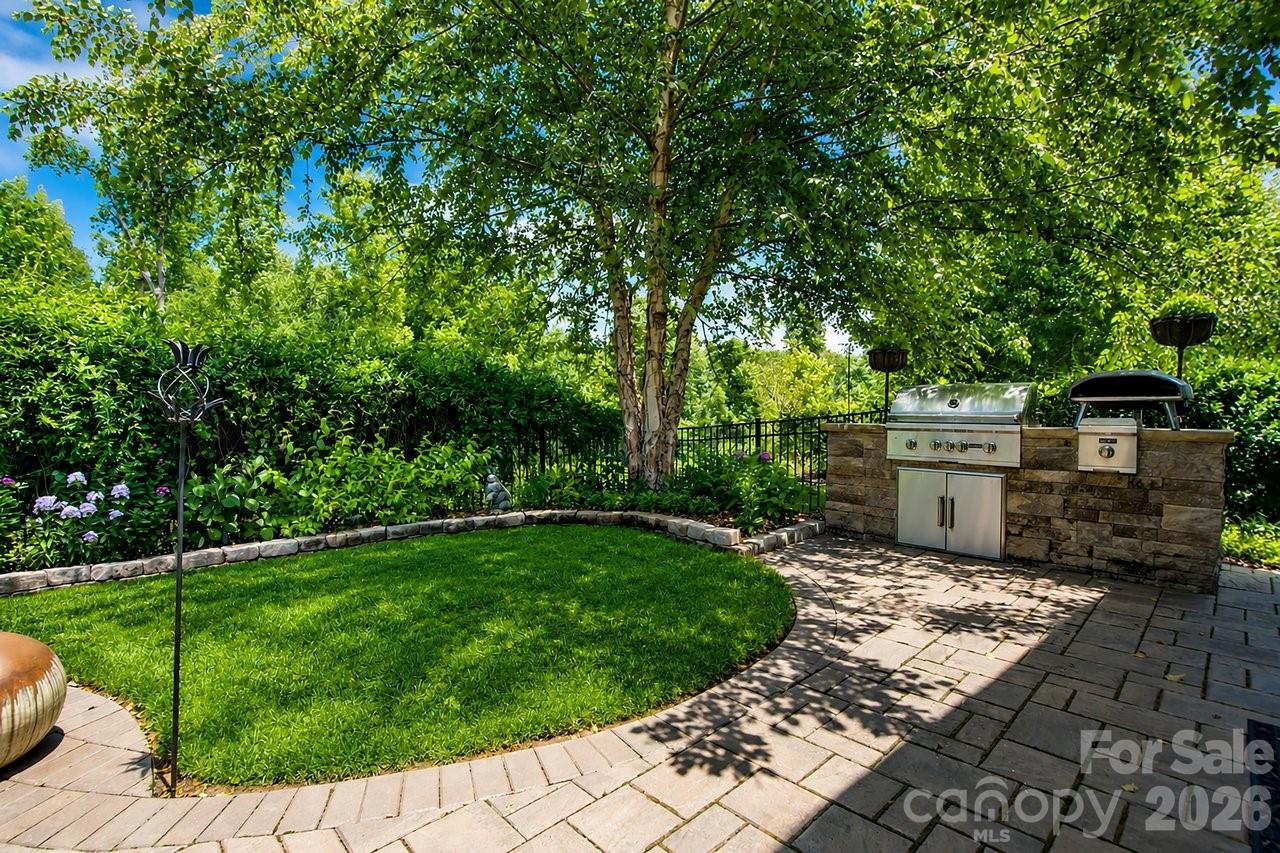 4854 Looking Glass Trail Denver, NC 28037 - Photo 21 of 48 a view of a backyard with a garden