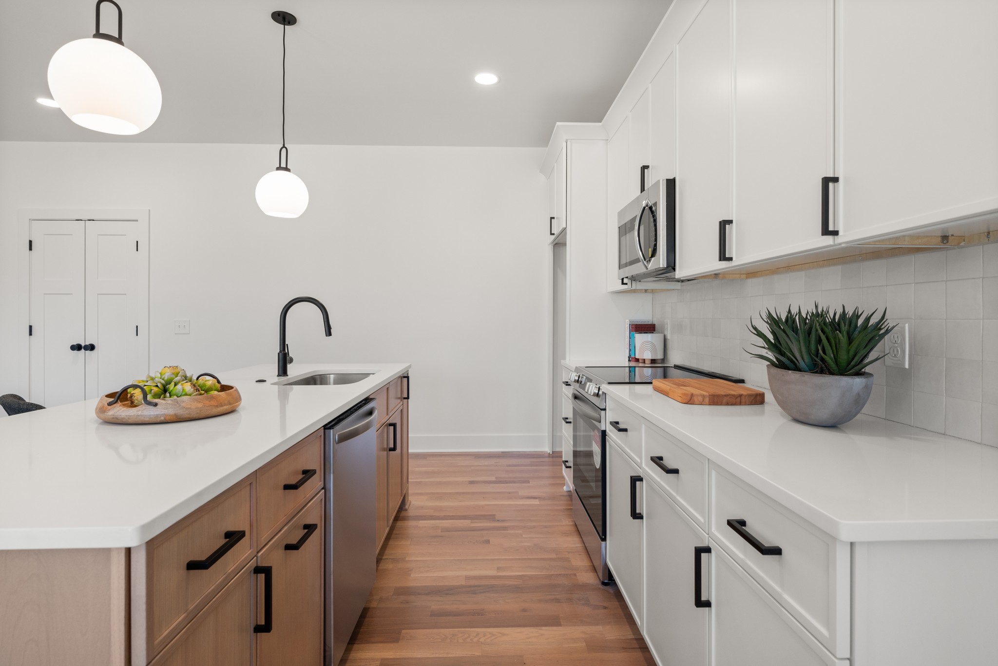 142 Lanier Drive Madison, TN 37115 - Photo 13 of 23 a kitchen with stainless steel appliances kitchen island granite countertop a sink a stove and a wooden floors