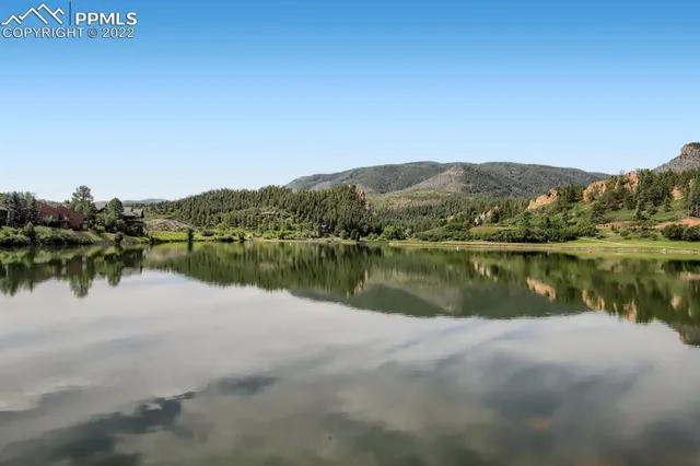 a view of a swimming pool with an outdoor seating