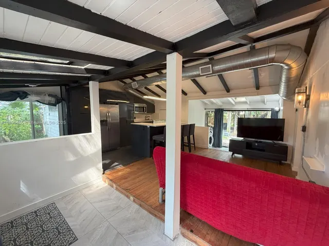 a view of living room and kitchen