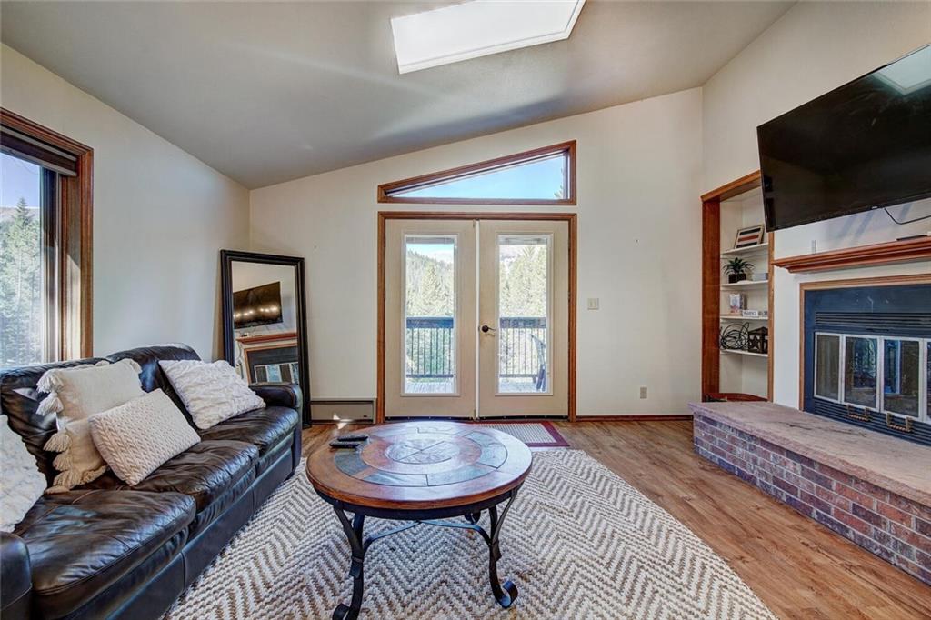 357 County Road 628 Breckenridge, CO 80424 - Photo 11 of 28 a living room with furniture and a fireplace