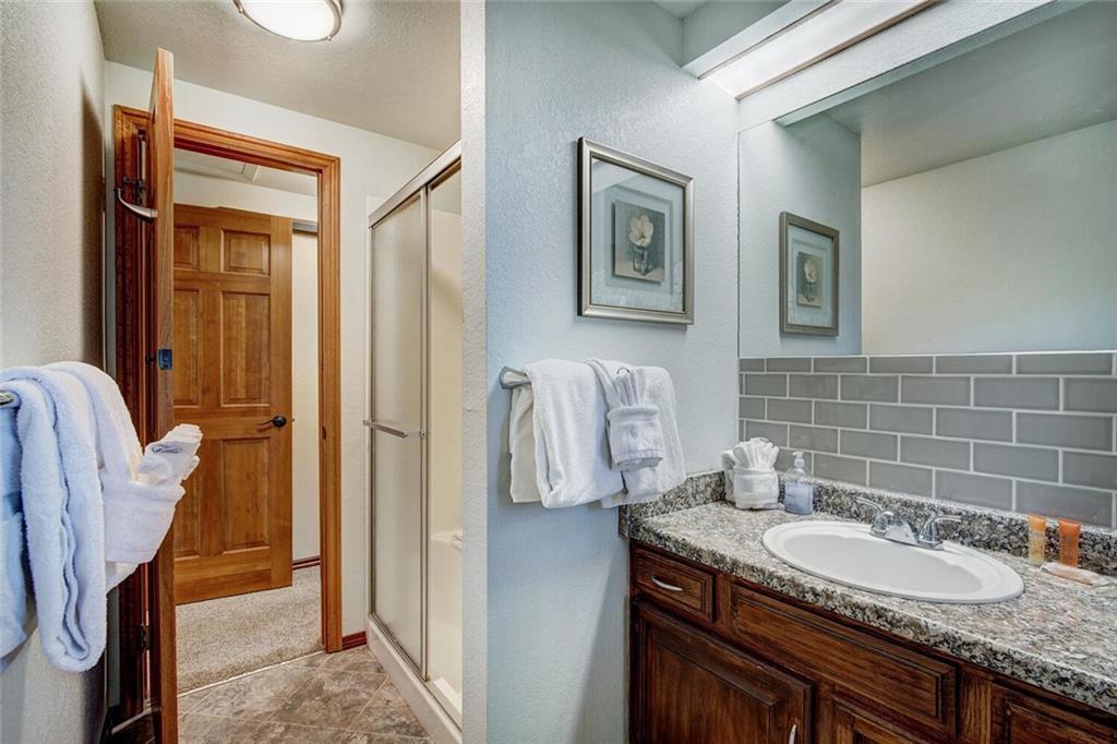 357 County Road 628 Breckenridge, CO 80424 - Photo 16 of 28 a bathroom with a granite countertop sink and a mirror