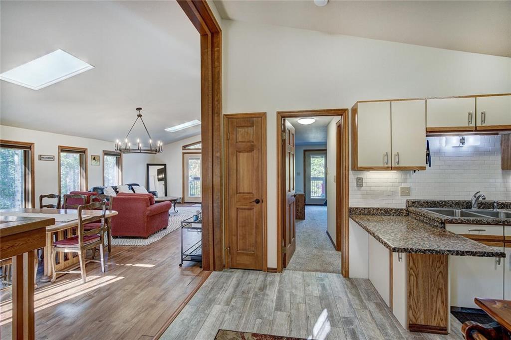 357 County Road 628 Breckenridge, CO 80424 - Photo 7 of 28 a kitchen with granite countertop a stove refrigerator and wooden floor