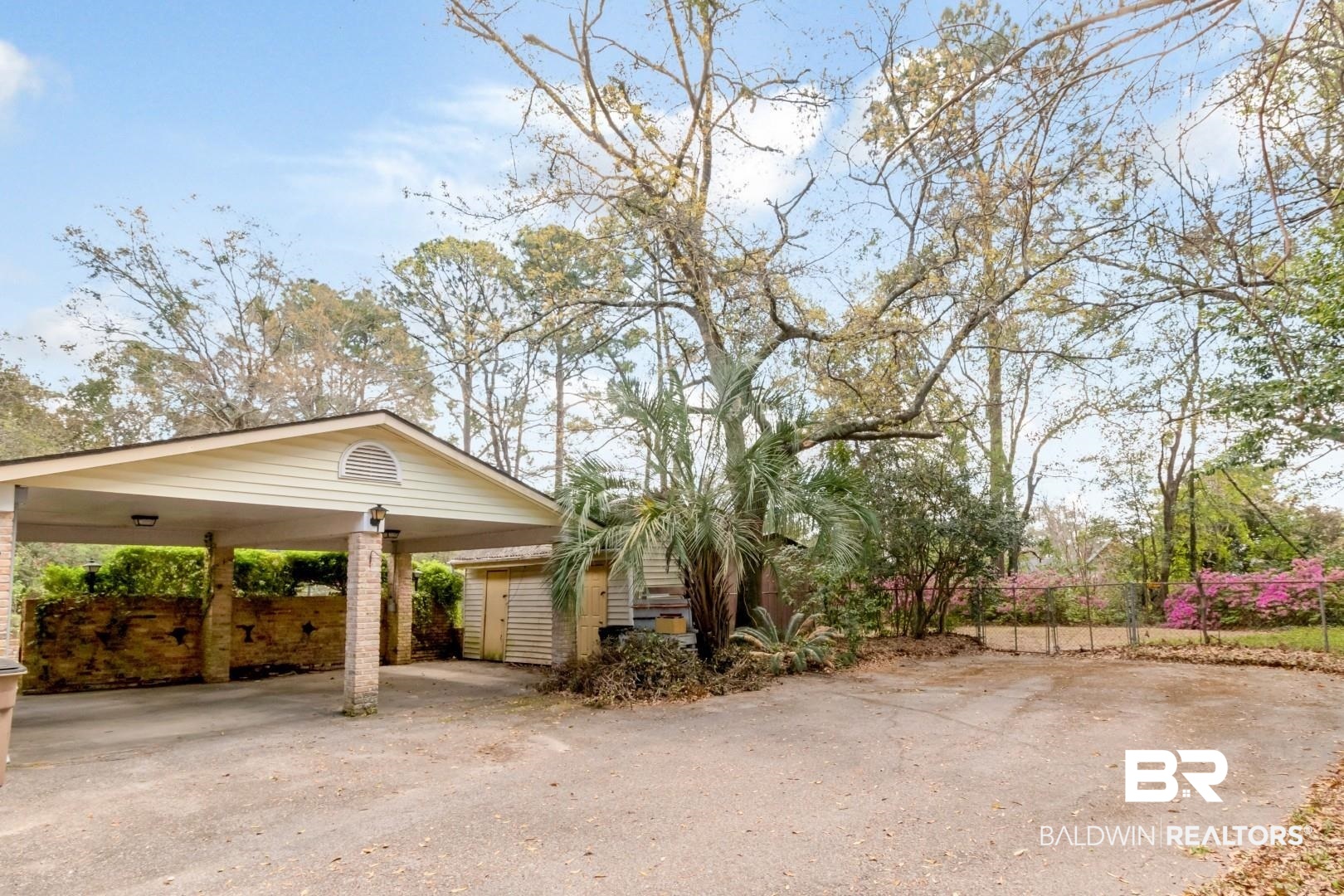 3715 South Conway Drive Mobile, AL 36608 - Photo 16 of 24 View of side of home featuring driveway and fence