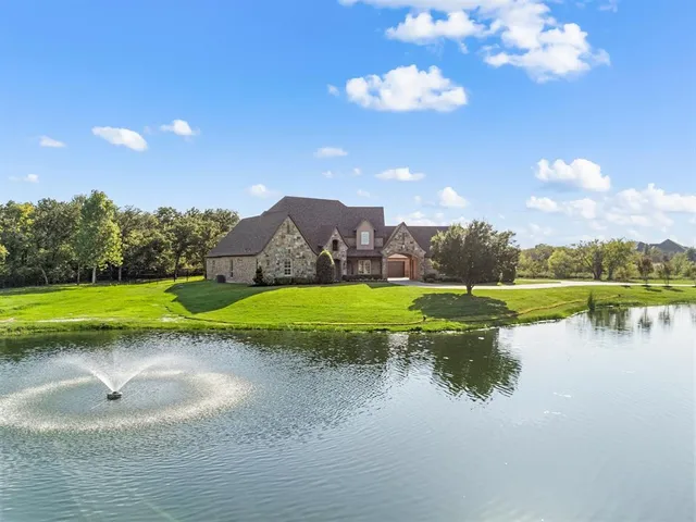 a view of a lake with a big yard