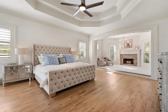 a bedroom with a bed and a fireplace