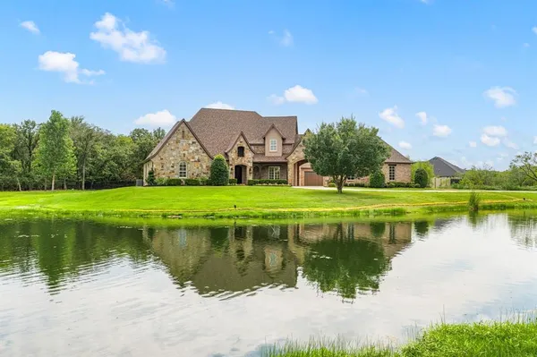 a dining room with furniture a chandelier and wooden floor