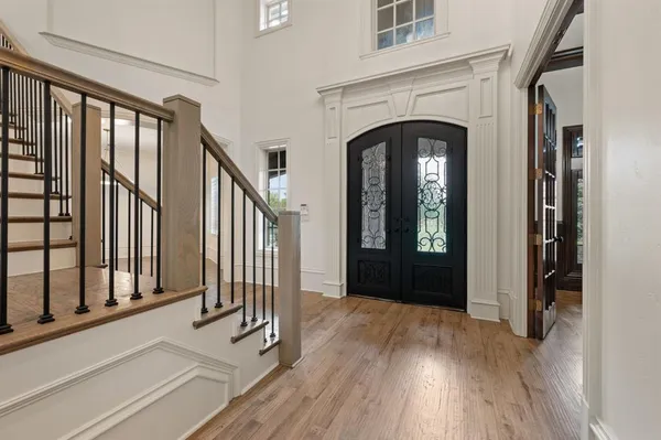 a living room with furniture wooden floor and a fireplace