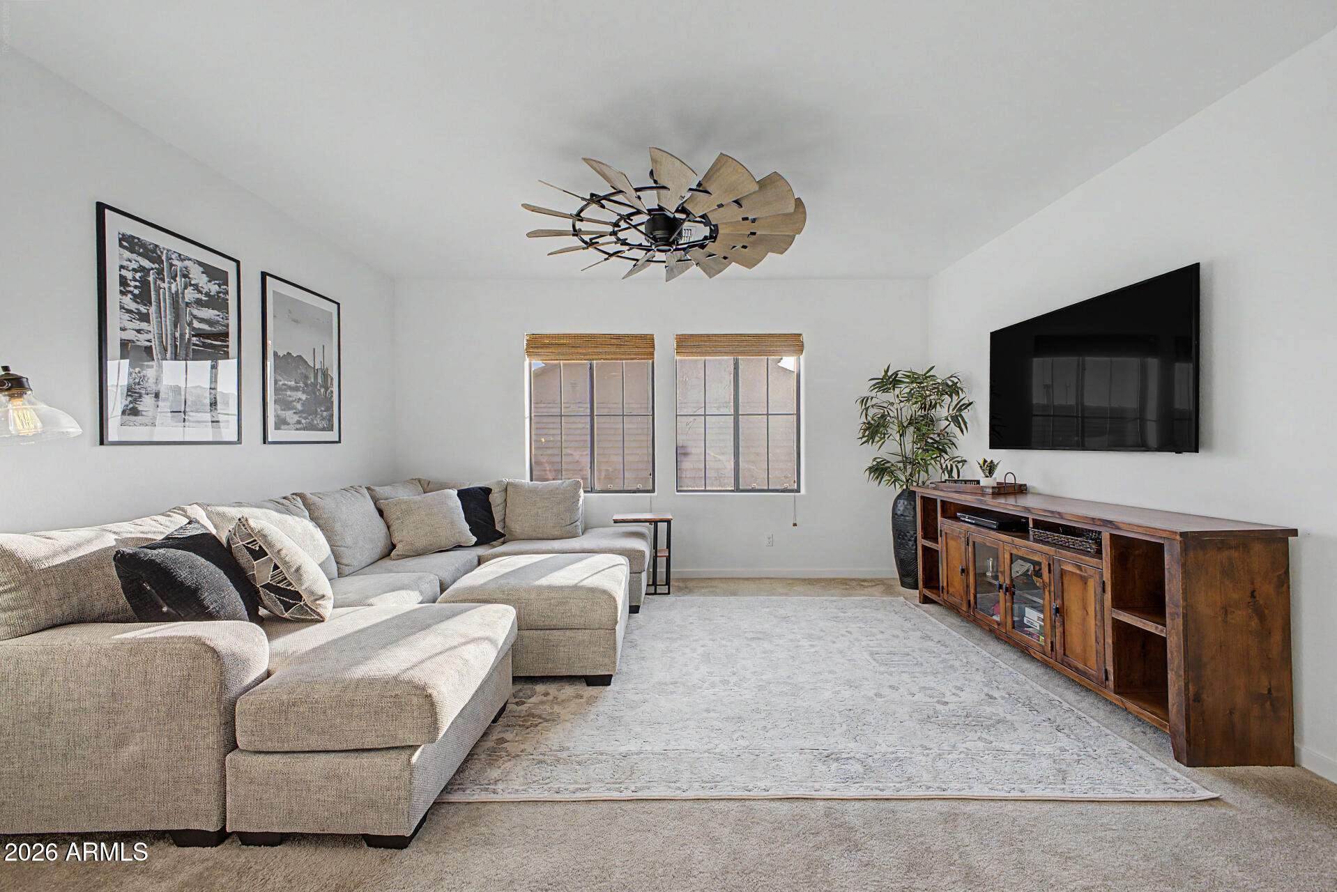 819 West Deer Creek Road Phoenix, AZ 85048 - Photo 47 of 76 a living room with furniture and a flat screen tv