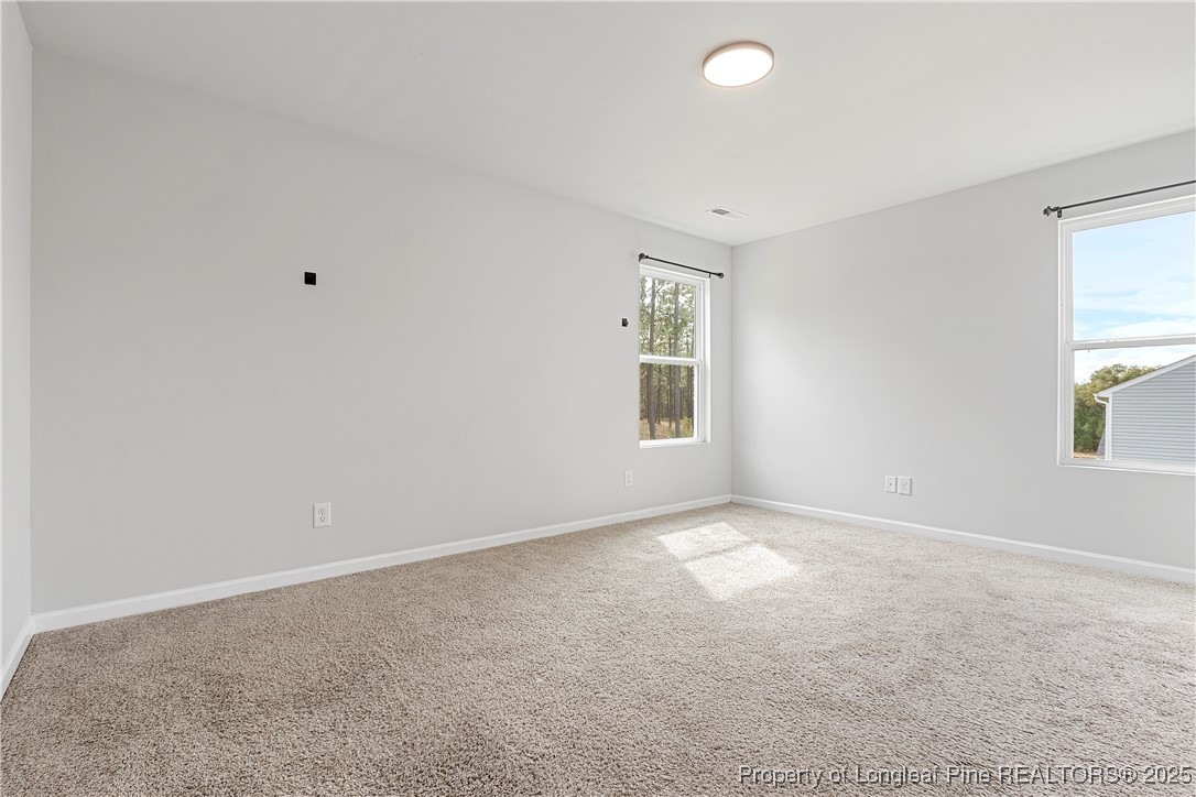 191 Mildred Way Aberdeen, NC 28315 - Photo 12 of 26 an empty room with windows