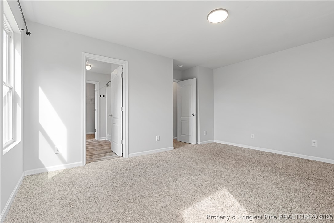 191 Mildred Way Aberdeen, NC 28315 - Photo 13 of 26 a view of a livingroom with an empty space and a window