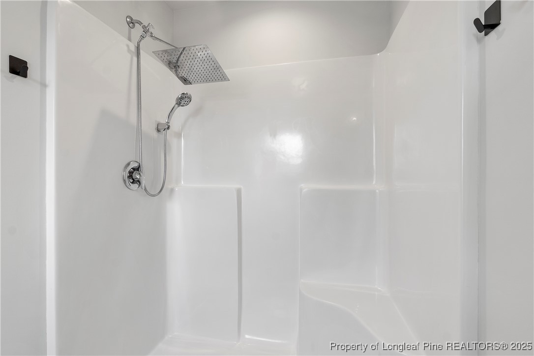 191 Mildred Way Aberdeen, NC 28315 - Photo 15 of 26 a bathroom with a shower