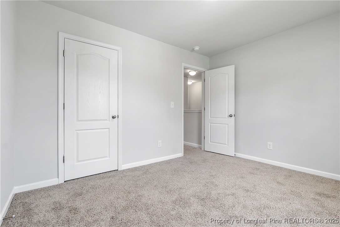 191 Mildred Way Aberdeen, NC 28315 - Photo 19 of 26 a view of an empty room and closet area