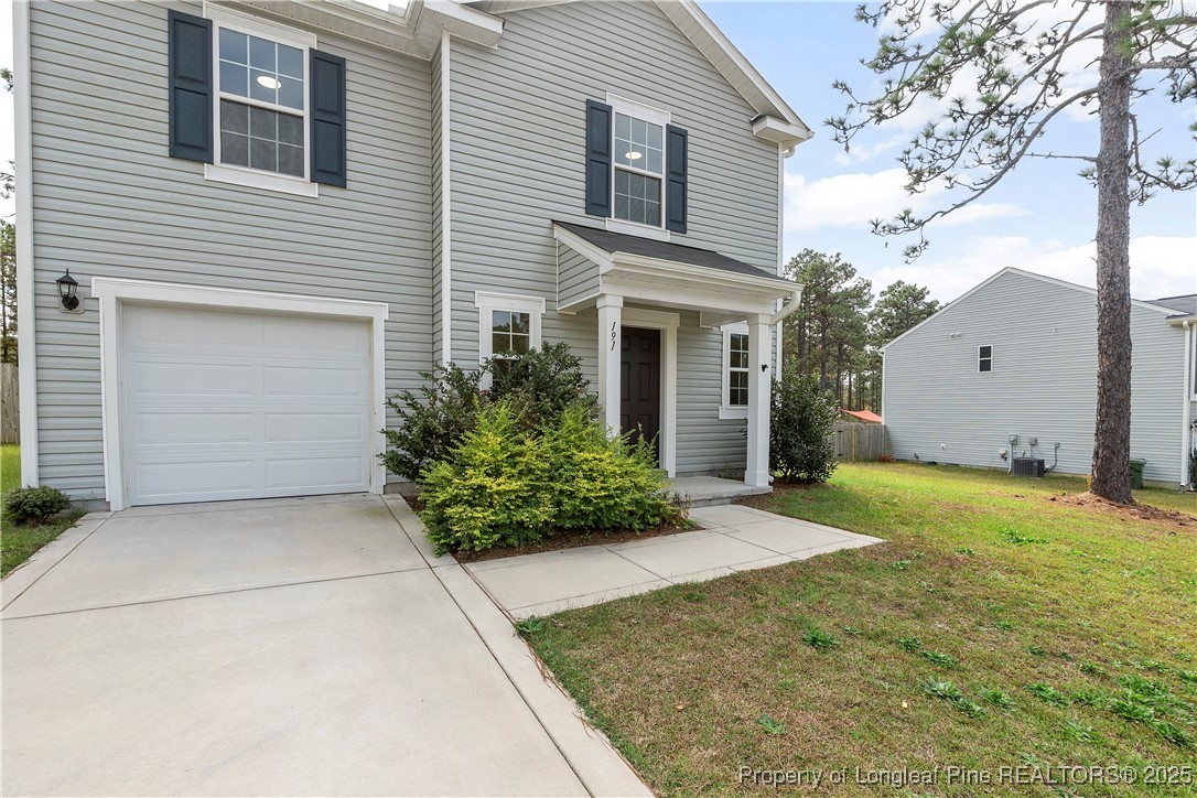 191 Mildred Way Aberdeen, NC 28315 - Photo 3 of 26 a view of a house with backyard and garden