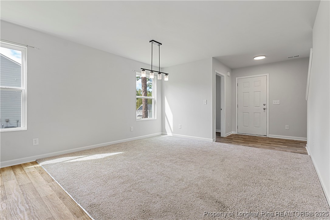 191 Mildred Way Aberdeen, NC 28315 - Photo 5 of 26 a view of an empty room with a window