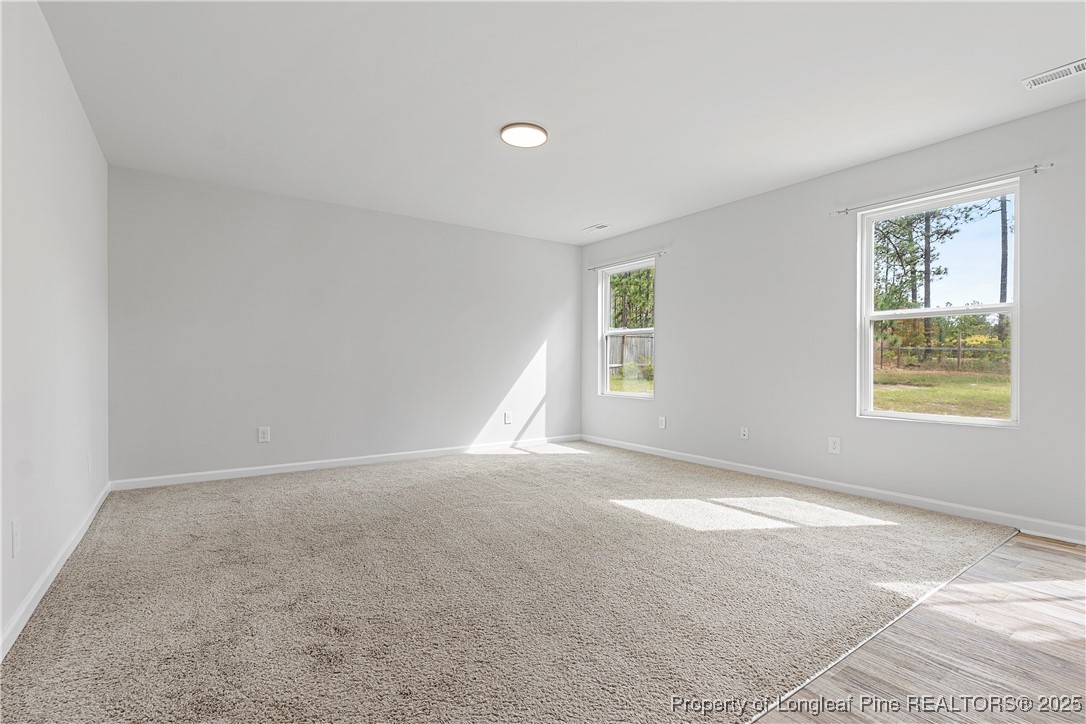 191 Mildred Way Aberdeen, NC 28315 - Photo 10 of 26 a view of an empty room with a window