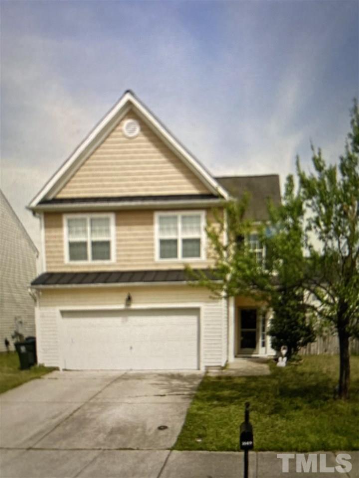 1649 Extine Lane Raleigh, NC 27610 - Photo 1 of 3 a front view of a house with a yard