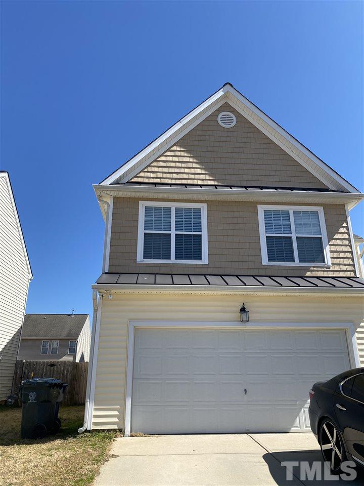 1649 Extine Lane Raleigh, NC 27610 - Photo 3 of 3 a front view of a house with parking space