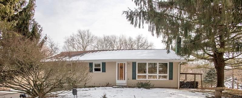 2491 Yost Road Bath, PA 18014 - Photo 1 of 42 a front view of a house with a garden