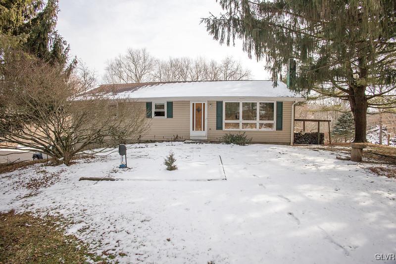 2491 Yost Road Bath, PA 18014 - Photo 2 of 42 a front view of a house with a yard covered with snow