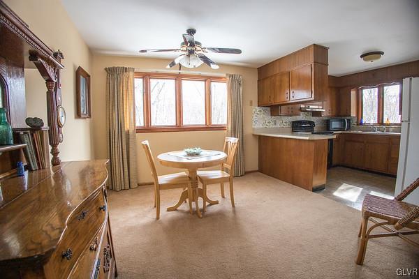 2491 Yost Road Bath, PA 18014 - Photo 21 of 42 a kitchen with sink a stove and cabinets