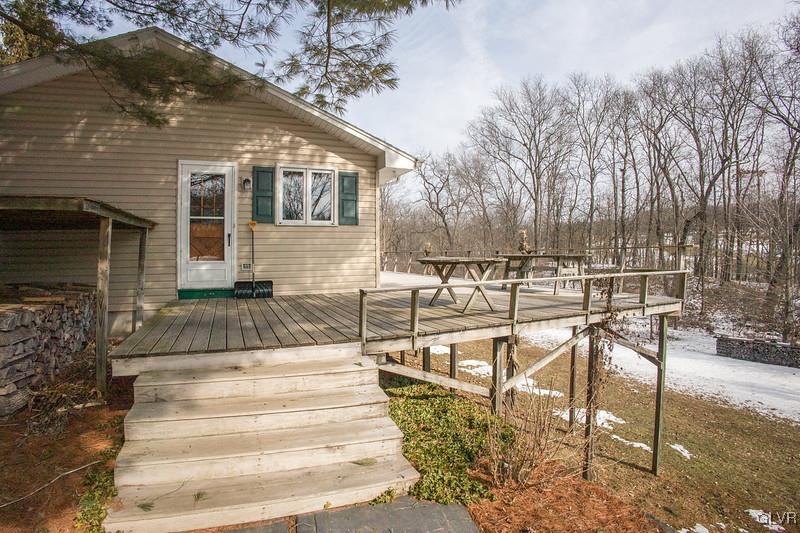 2491 Yost Road Bath, PA 18014 - Photo 10 of 42 a view of a patio with table and chairs with wooden floor and fence