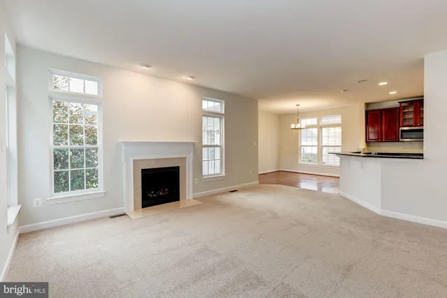 a kitchen with stainless steel appliances granite countertop a stove top oven a sink and dishwasher