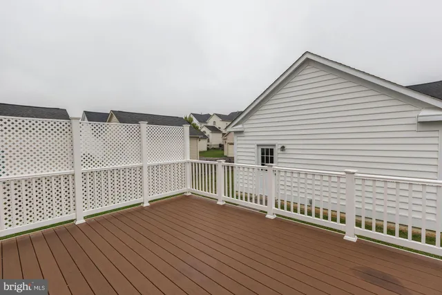 a view of a balcony with wooden floor
