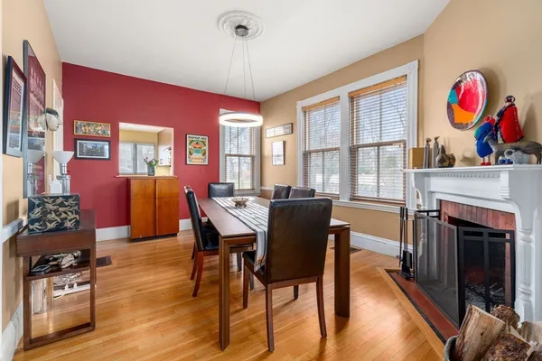a dinning table and chairs in a living room