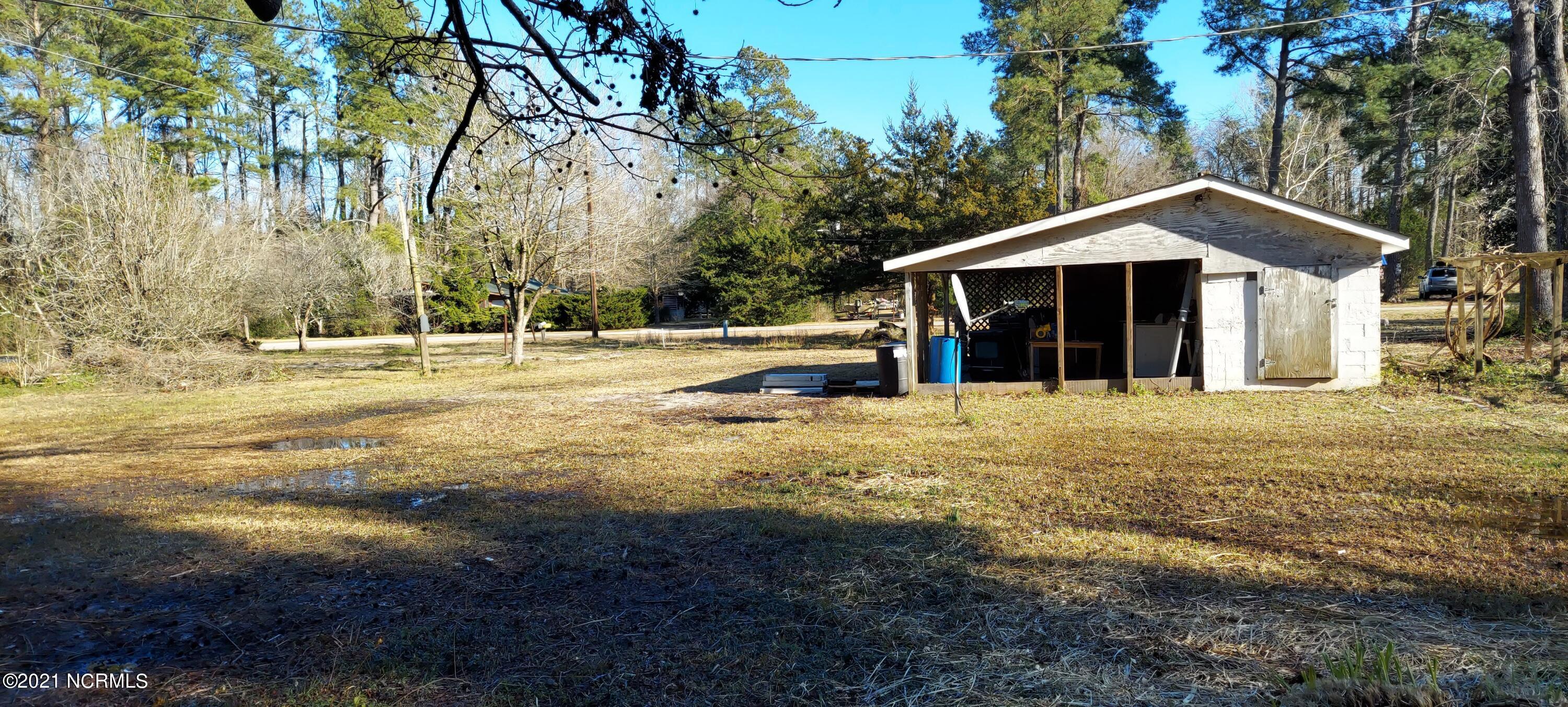 5572 Blueberry Road Currie, NC 28435 - Photo 18 of 19 back shed with covered storage