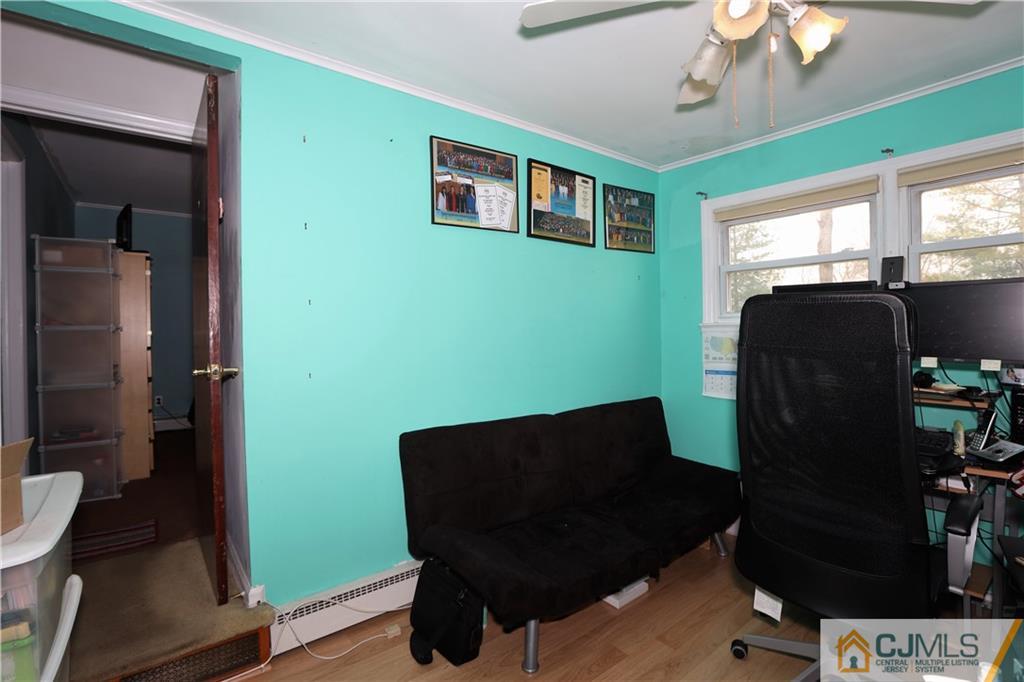 120 South Hill Road Colonia, NJ 07067 - Photo 11 of 26 a view of a workspace with furniture and a window