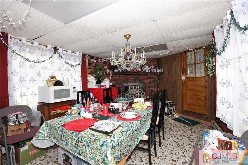 120 South Hill Road Colonia, NJ 07067 - Photo 16 of 26 a view of a dining room with furniture and chandelier