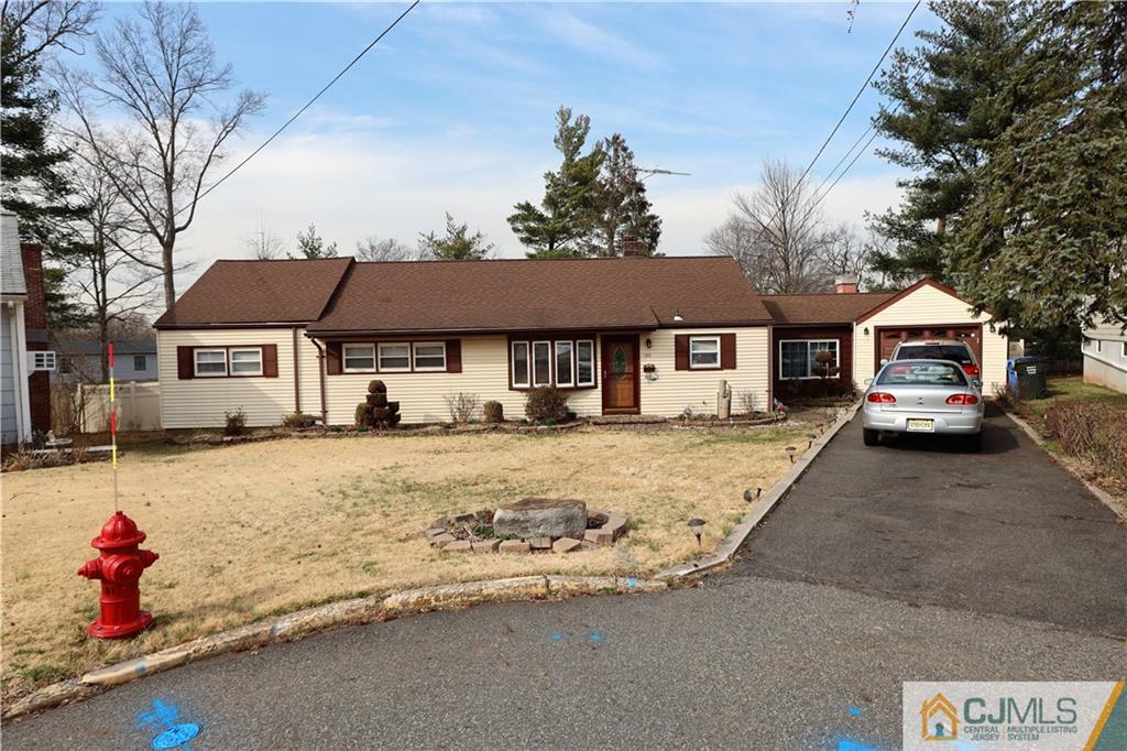 120 South Hill Road Colonia, NJ 07067 - Photo 2 of 26 a front view of a house with a yard