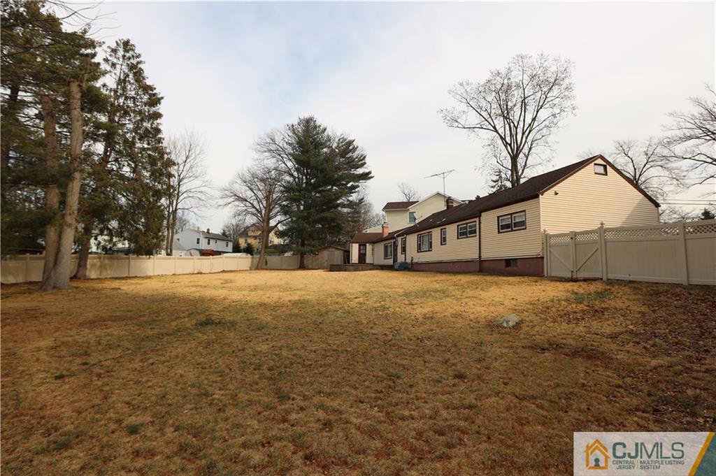 120 South Hill Road Colonia, NJ 07067 - Photo 24 of 26 a front view of house with yard and trees around