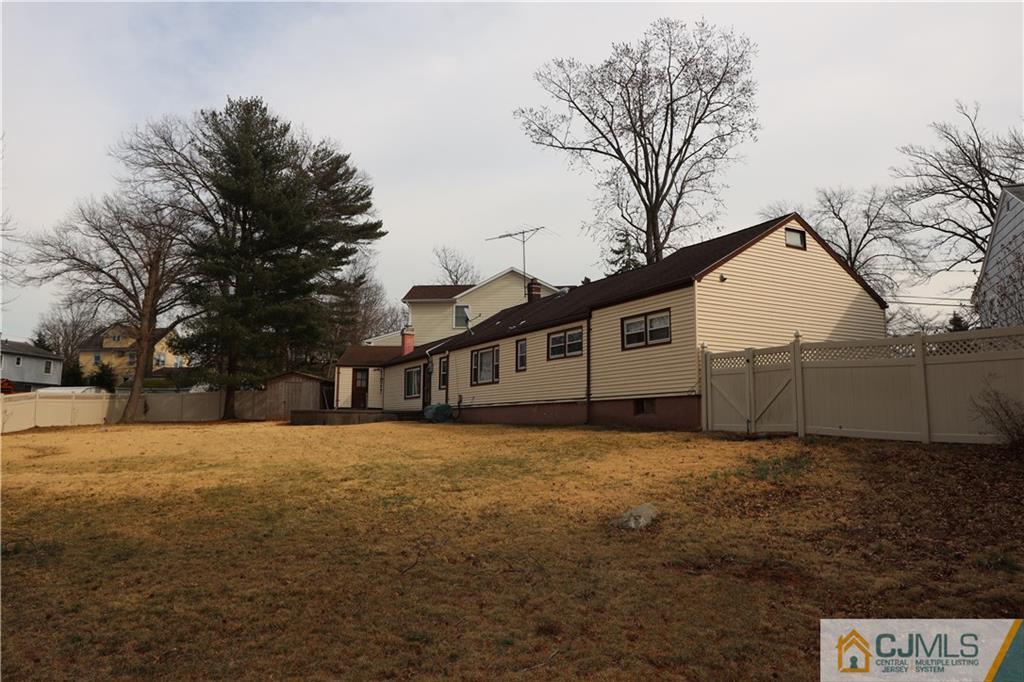 120 South Hill Road Colonia, NJ 07067 - Photo 25 of 26 a front view of a house with a yard covered in snow