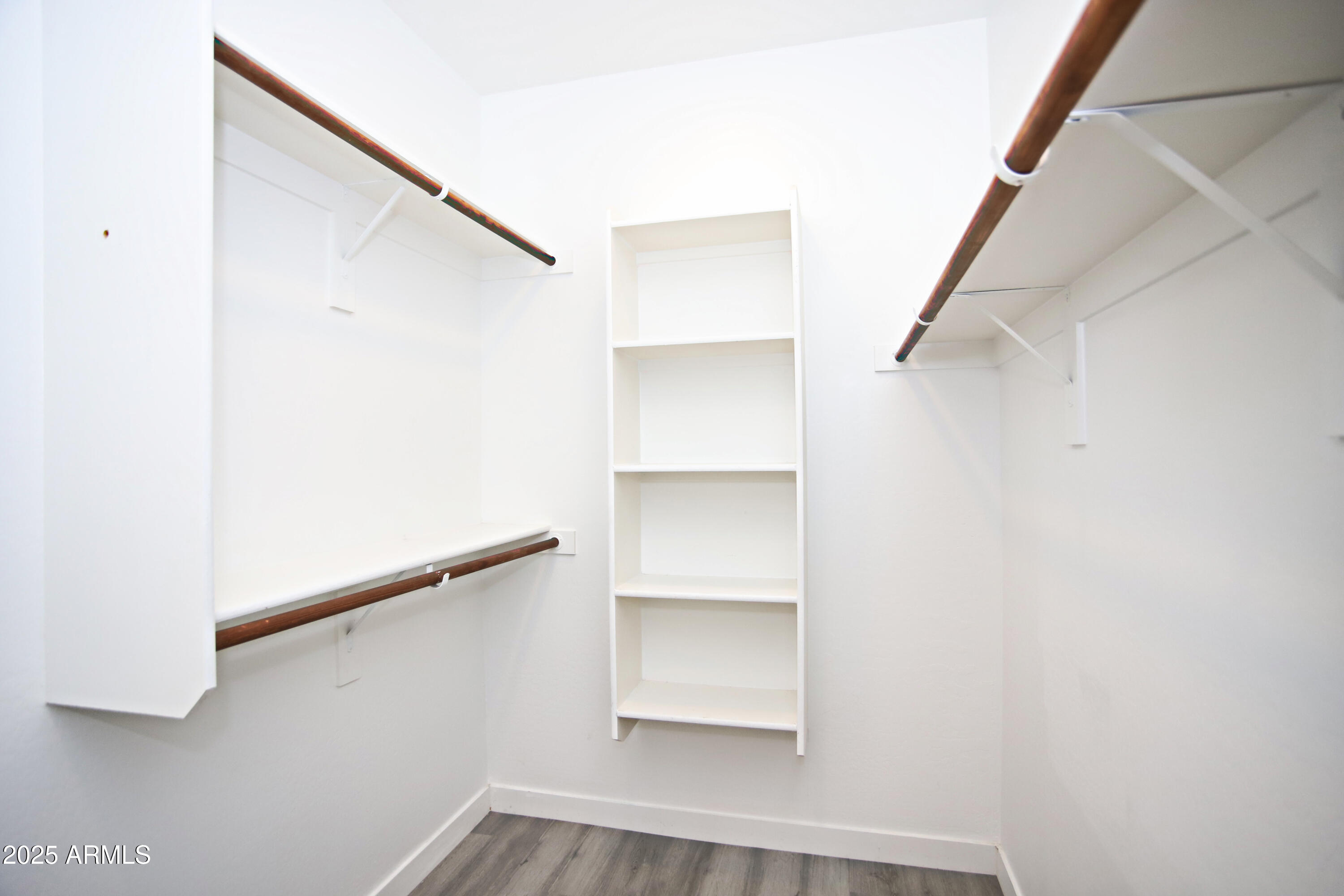 1535 West Corral Road Phoenix, AZ 85041 - Photo 27 of 39 a view of an empty walk in closet