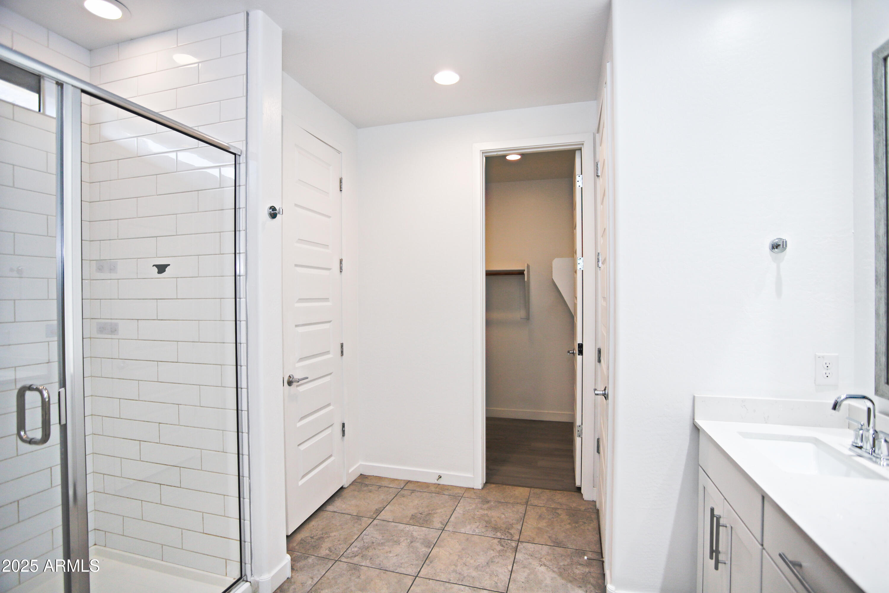 1535 West Corral Road Phoenix, AZ 85041 - Photo 28 of 39 a bathroom with a sink and a shower