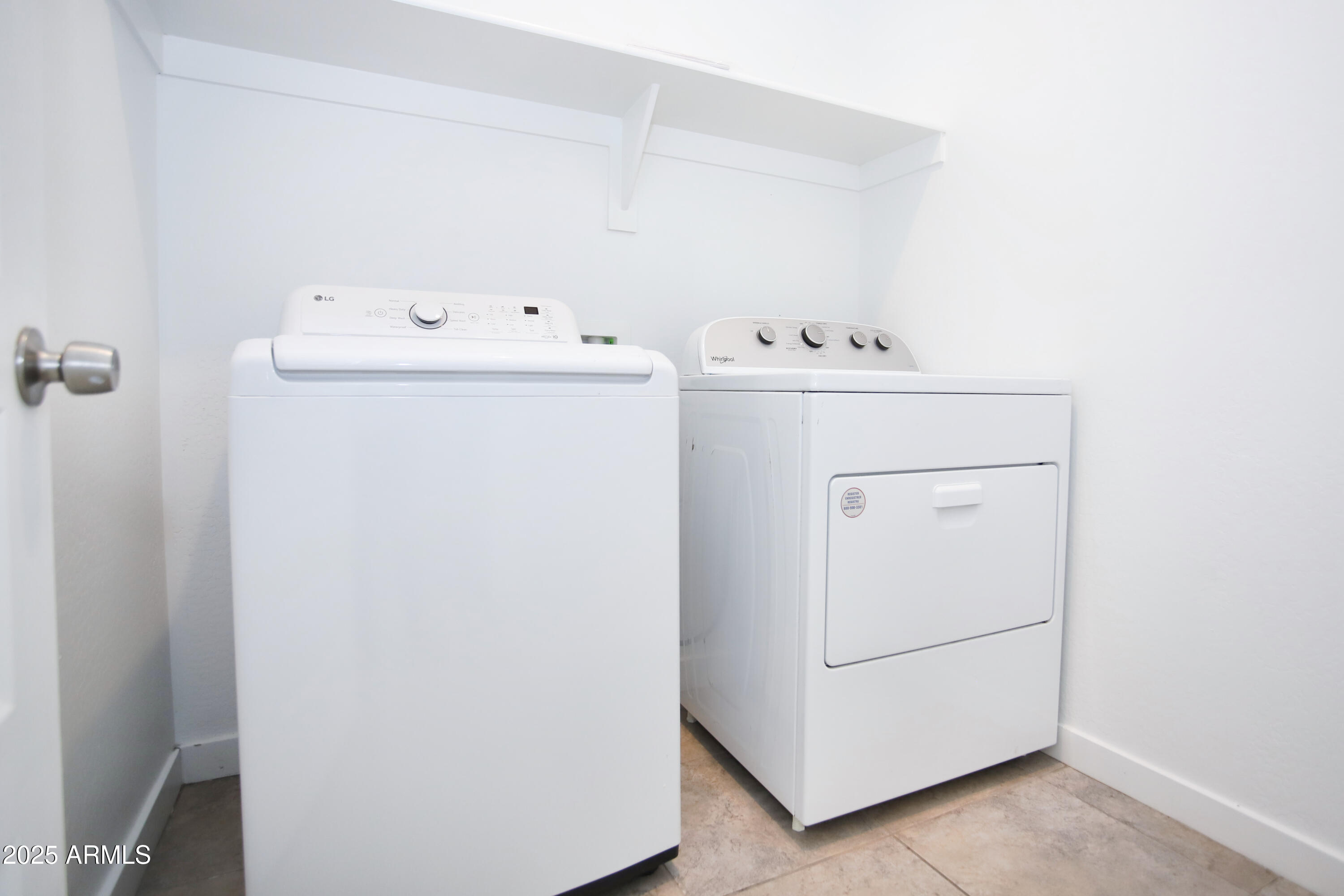 1535 West Corral Road Phoenix, AZ 85041 - Photo 29 of 39 a utility room with dryer and washer