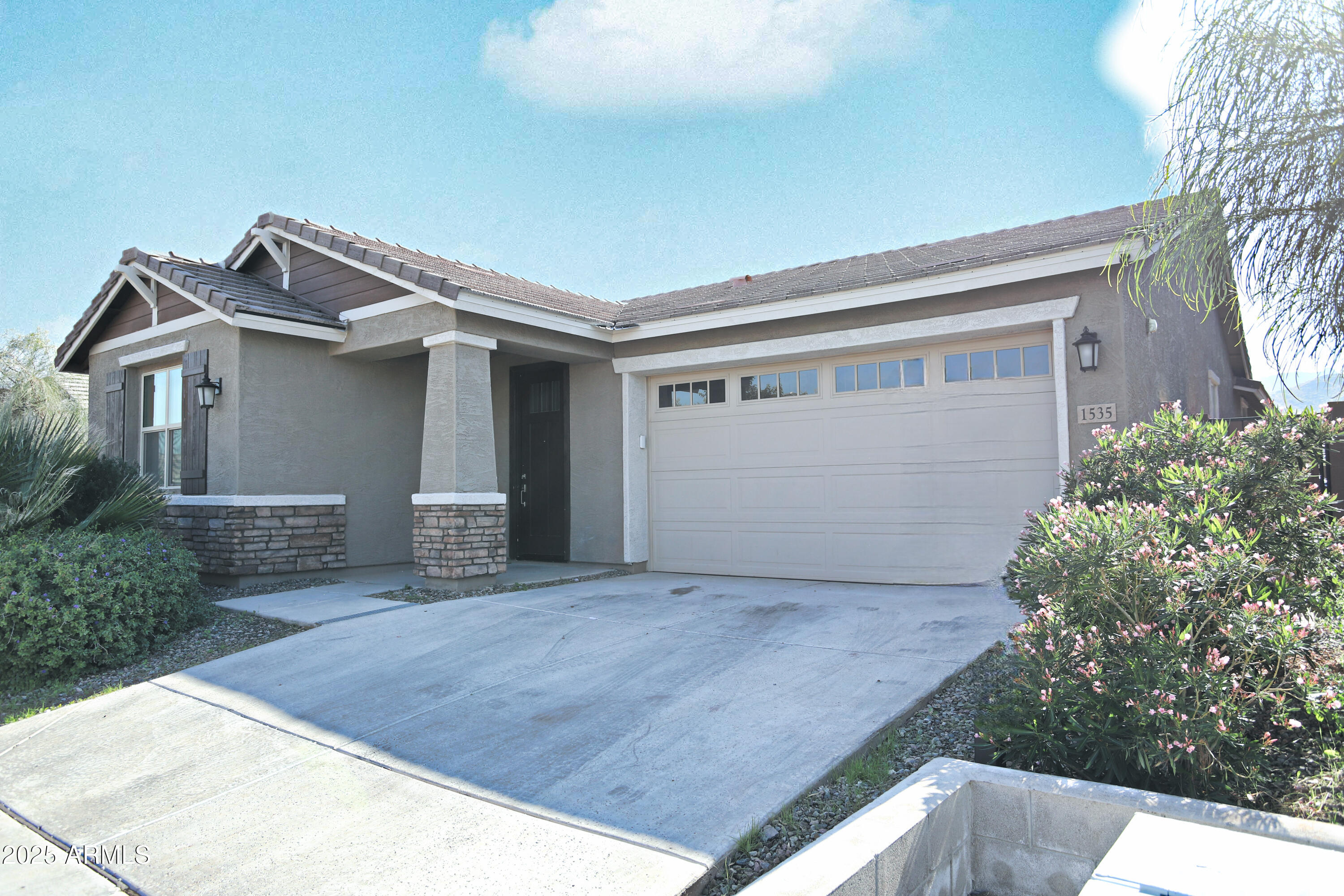 1535 West Corral Road Phoenix, AZ 85041 - Photo 3 of 39 a view of house with garage and small yard