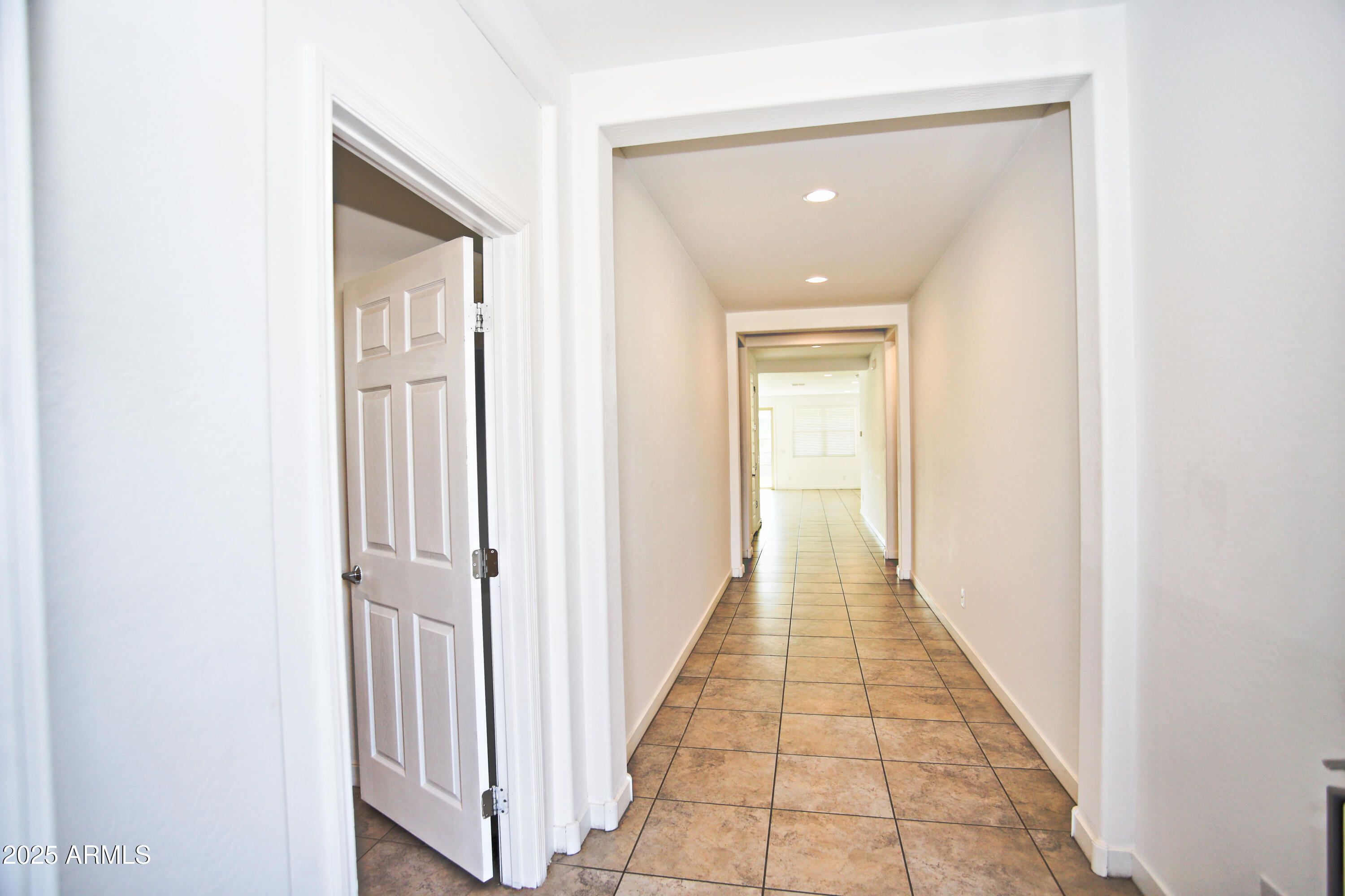 1535 West Corral Road Phoenix, AZ 85041 - Photo 5 of 39 a view of a hallway with white walls
