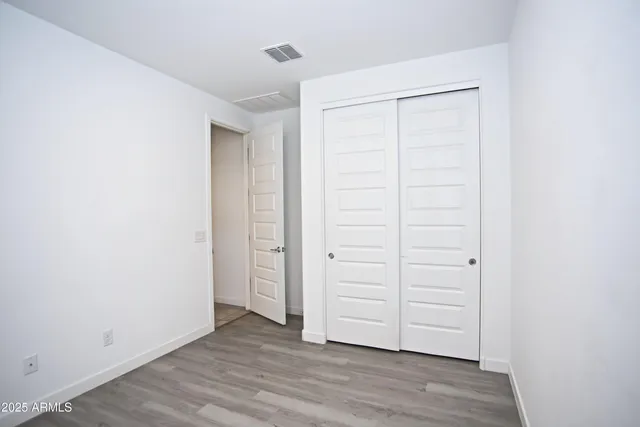a bathroom with a bathtub shower sink vanity and toilet