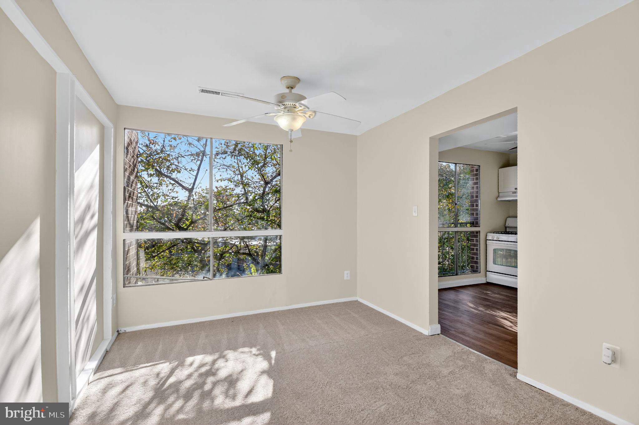 7957 Riggs Road, Unit 7 Hyattsville, MD 20783 - Photo 3 of 15 wooden floor in an empty room with a window
