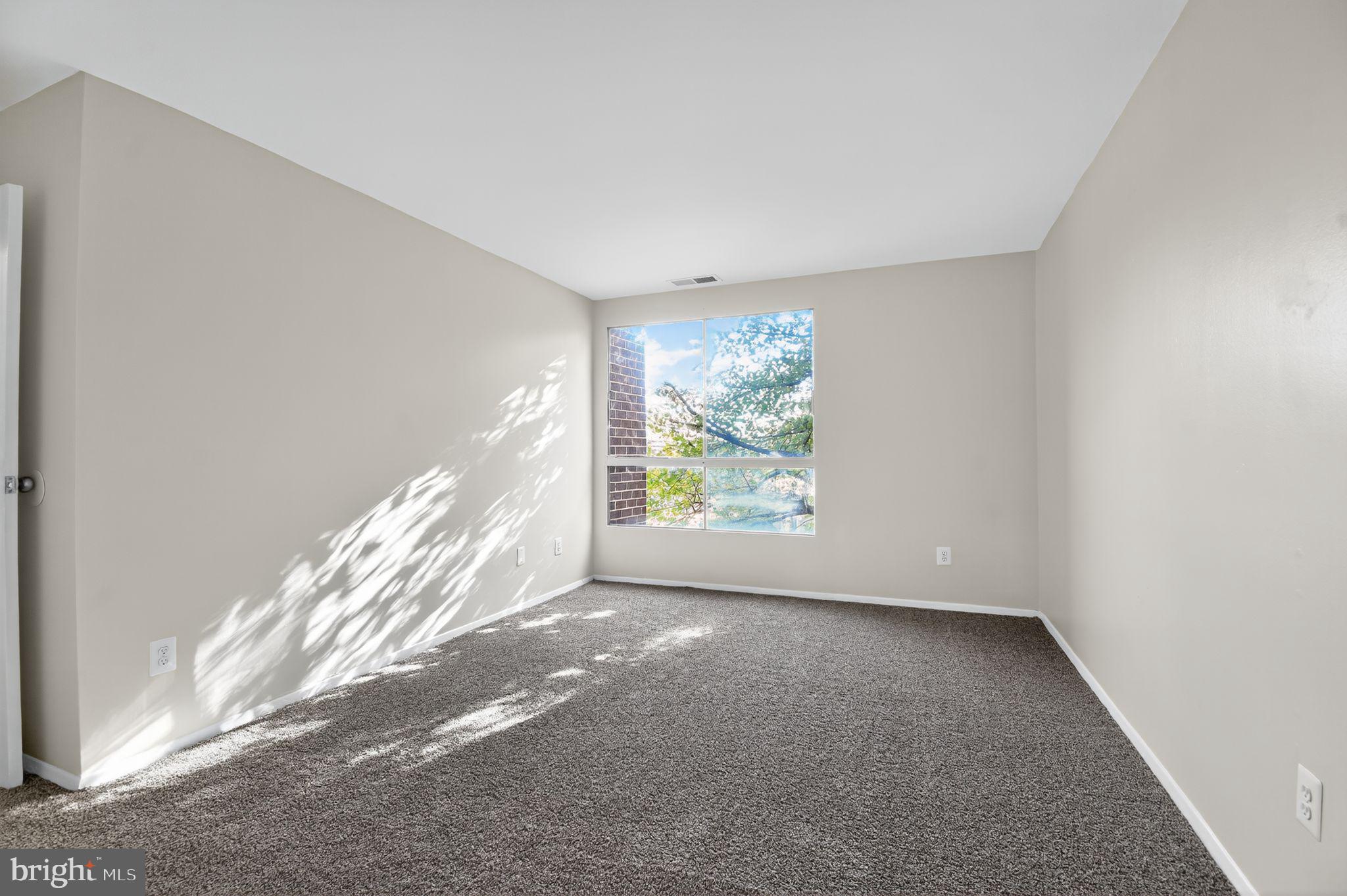 7957 Riggs Road, Unit 7 Hyattsville, MD 20783 - Photo 6 of 15 a view of empty room with window