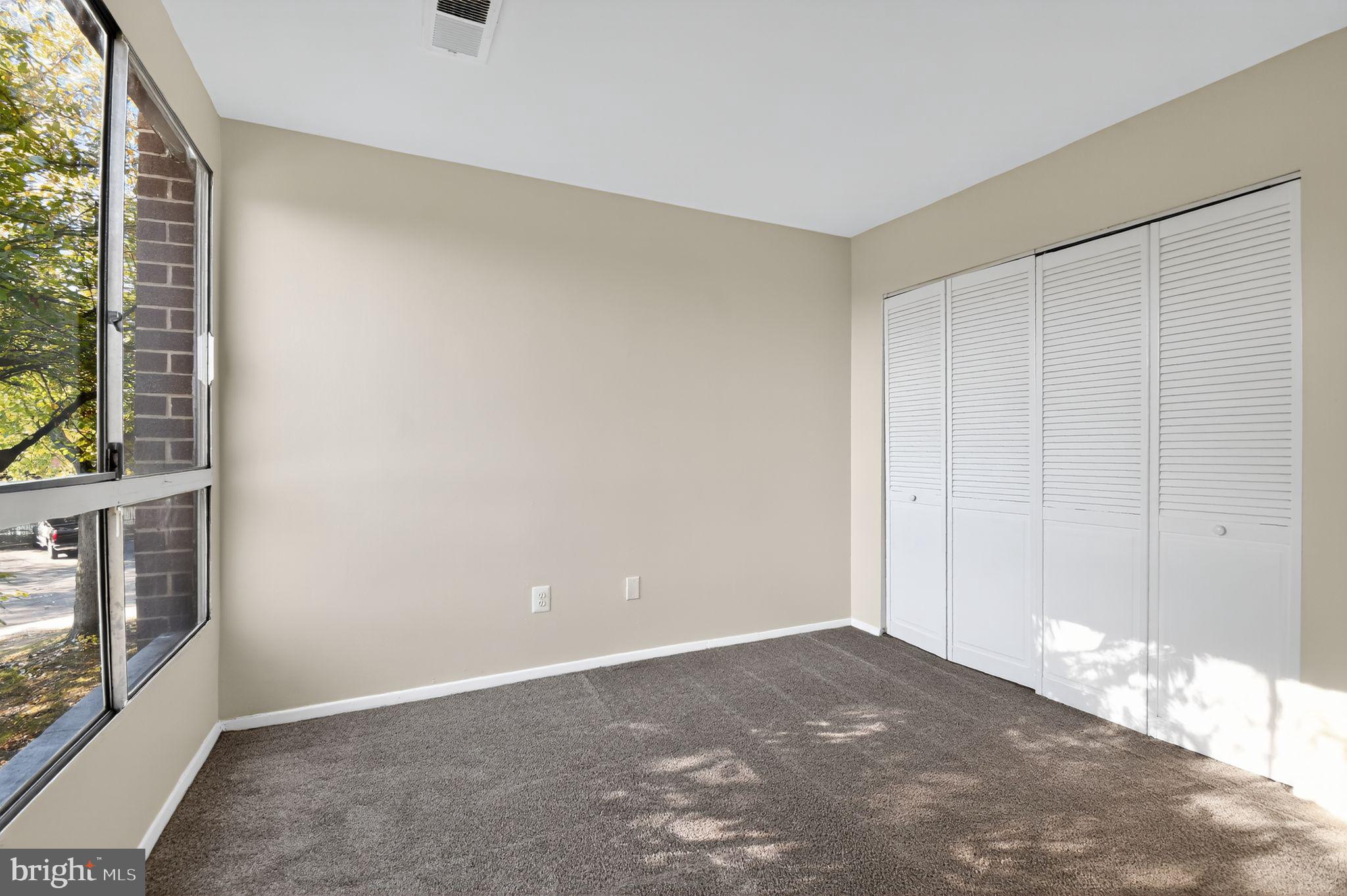 7957 Riggs Road, Unit 7 Hyattsville, MD 20783 - Photo 8 of 15 a view of a livingroom with an empty space and a window