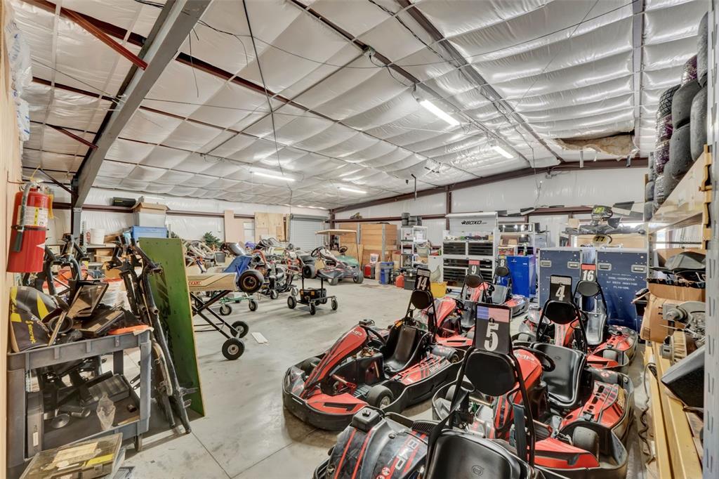 5821 Pit Road Bushnell, FL 33513 - Photo 14 of 35 a view of a storage room with a lot of stuff