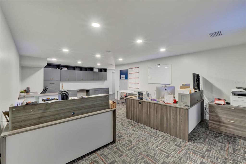 5821 Pit Road Bushnell, FL 33513 - Photo 17 of 35 a kitchen with stainless steel appliances granite countertop a sink and cabinets