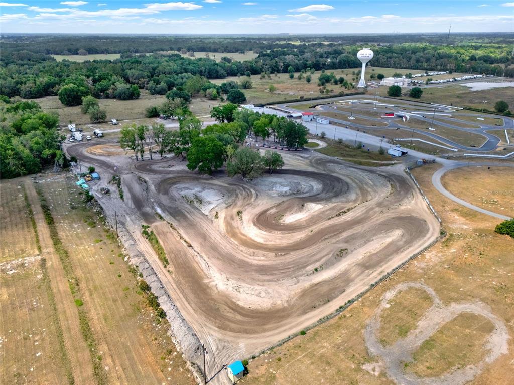 5821 Pit Road Bushnell, FL 33513 - Photo 3 of 35 a view of a swimming pool with a yard
