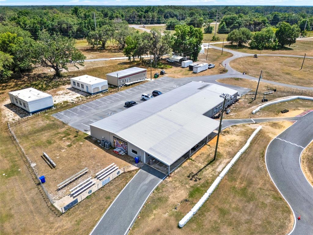 5821 Pit Road Bushnell, FL 33513 - Photo 31 of 35 an aerial view of a swimming pool with lounge chair